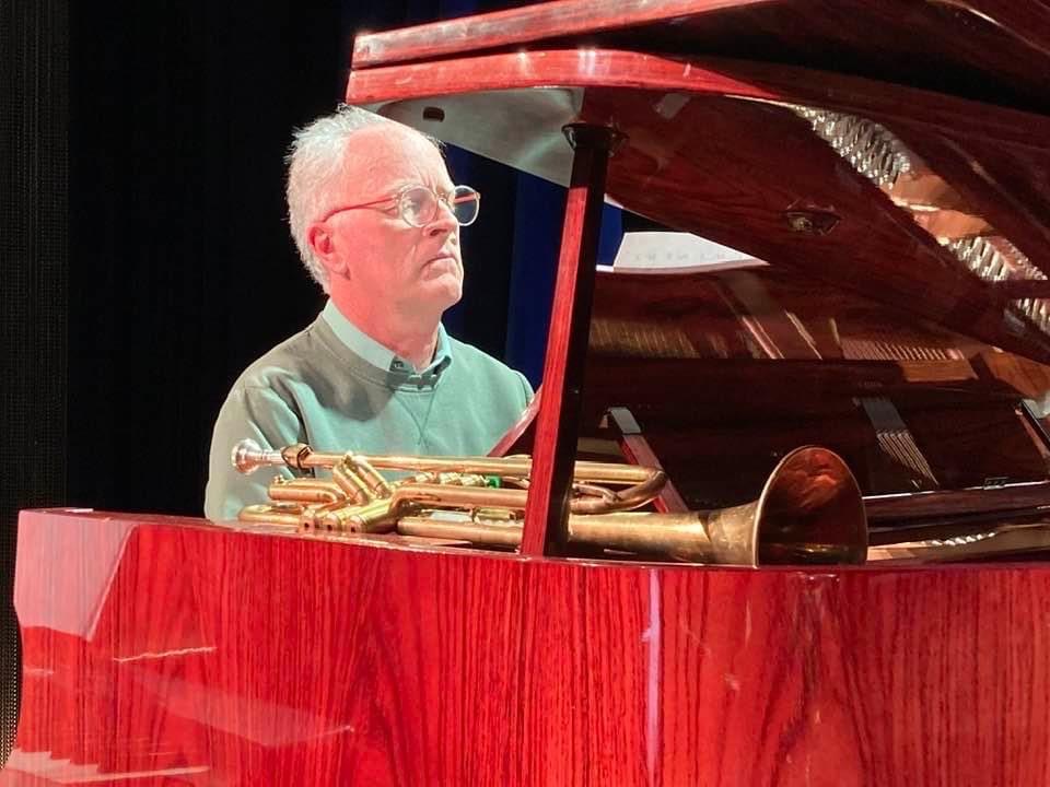 Playing the red piano.